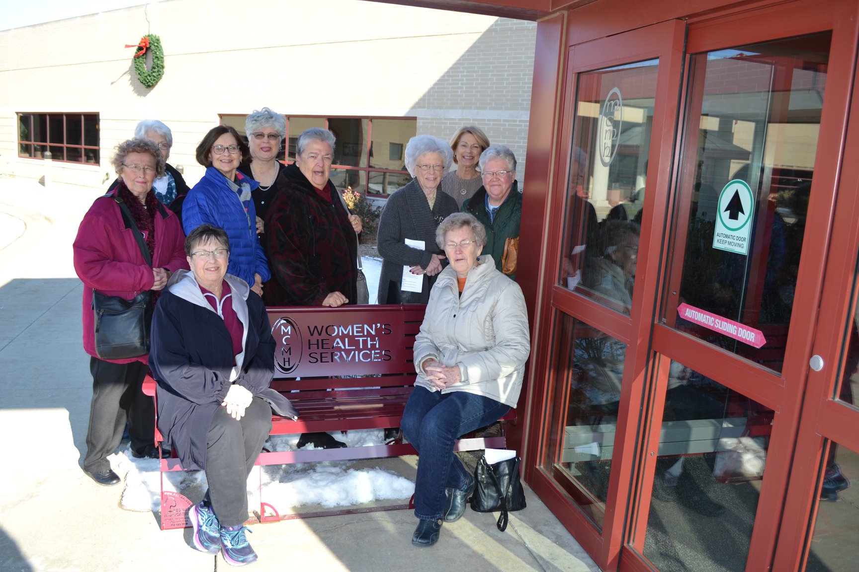 Auxiliary Members by the bench they donated Auxiliary Members by the bench they donated